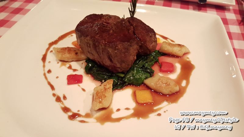 Beef fillet with fresh herbs, spinach and potato gnocchi
